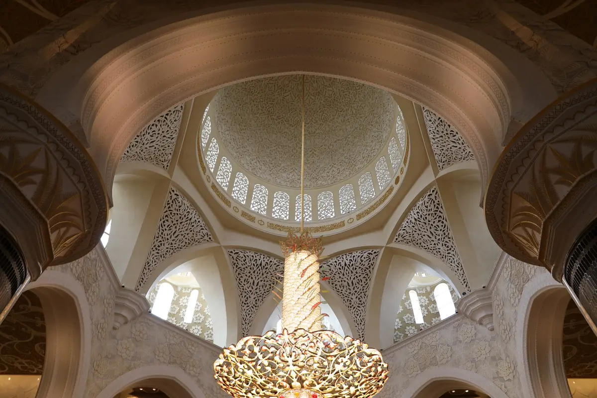 A dome and chandelier above the prayer hall